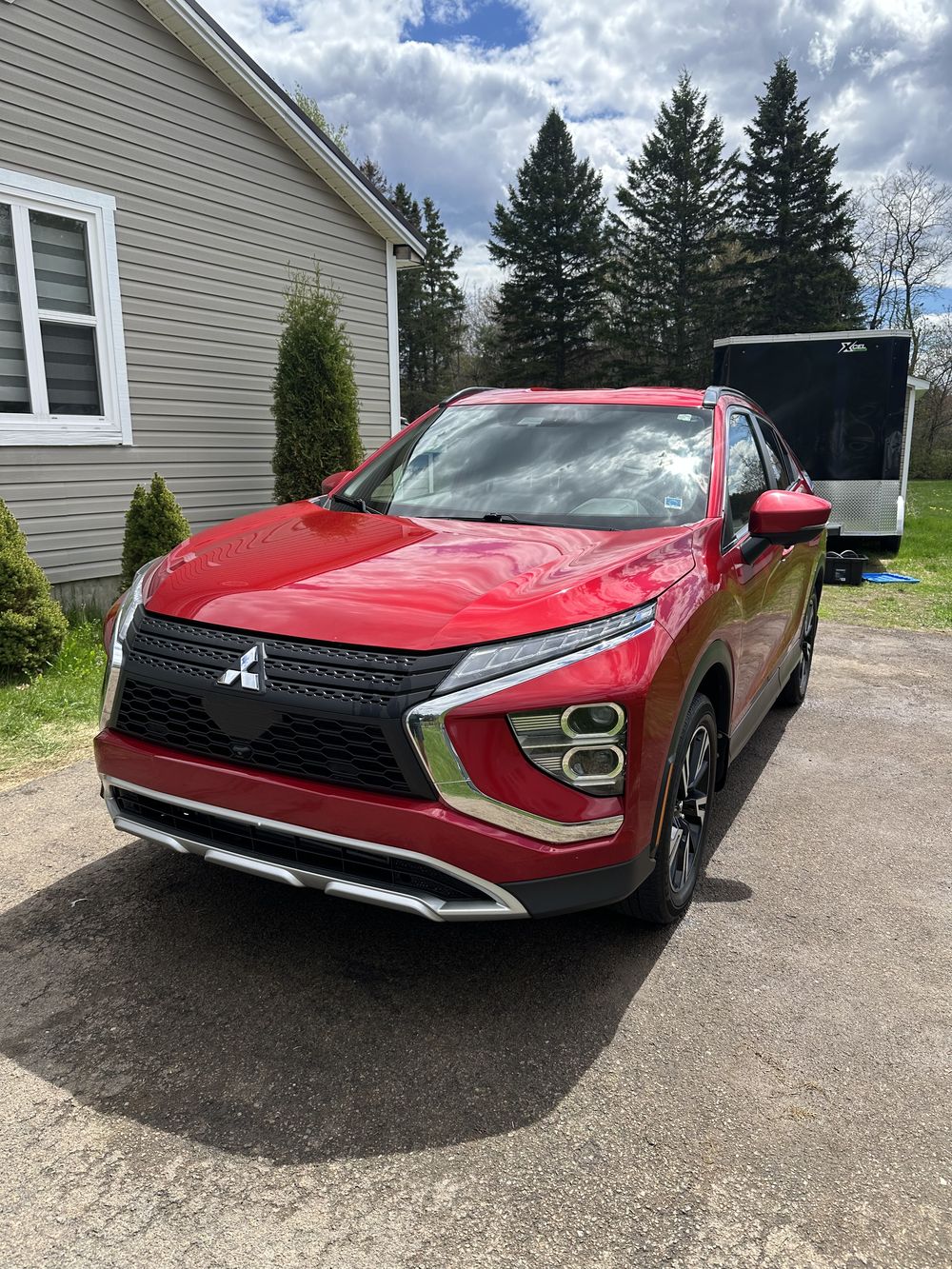 Glossy red SUV after an exterior wash and detail