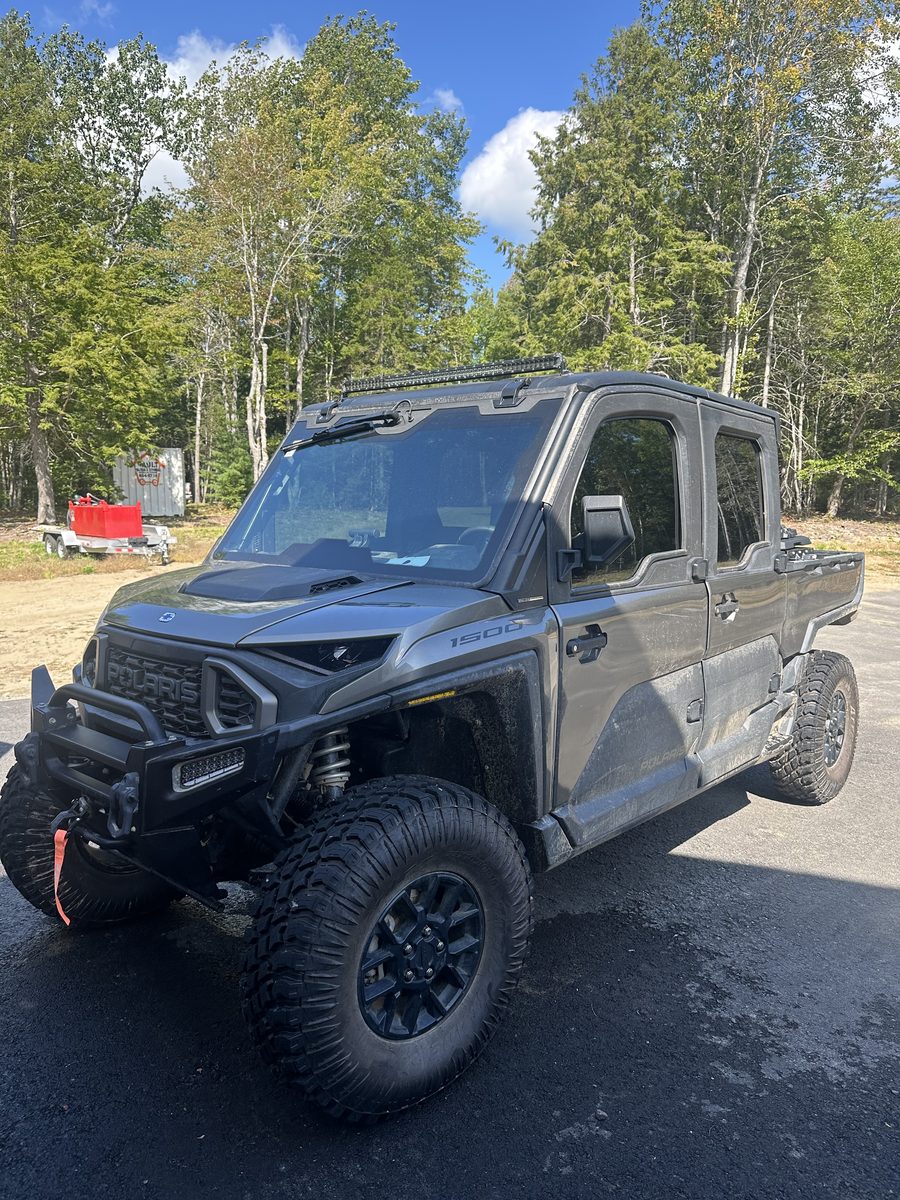 Mud-covered side-by-side (SXS) before detailing